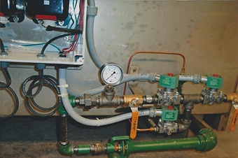 Close up ofignition system on a gas-heated black oxide tank Close up ofignition system on a gas-heated black oxide tank