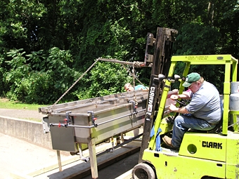 Our employees carefully loading Easy Black System onto wooden skids prior to shipment. Our employees carefully loading Easy Black System onto wooden skids prior to shipment.