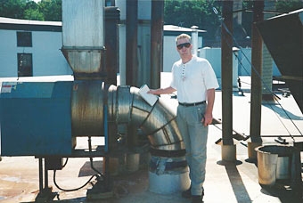 Patrick smith, VP, inspecting large exhaust system at Tool Gage Manufacturer. Patrick smith, VP, inspecting large exhaust system at Tool Gage Manufacturer.
