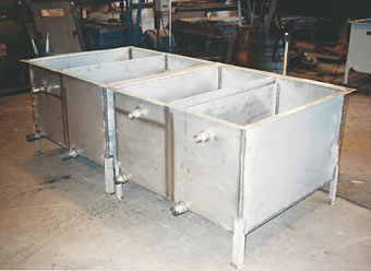 Stainless Steel Cascading Rinse Tanks prior to final inspection in welding department. Stainless Steel Cascading Rinse Tanks prior to final inspection in welding department.